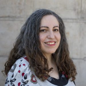 Fotografía de Claudia Miranda sonriendo.